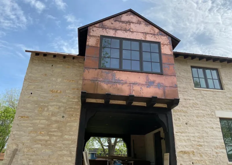 Copper metal panel facade on a stone building for Metal Roof Coating in Glenpool