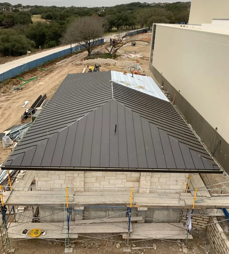 Metal roof new construction with scaffolding in Glenpool